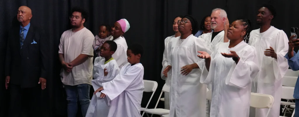 Baptismal candidates worshipping